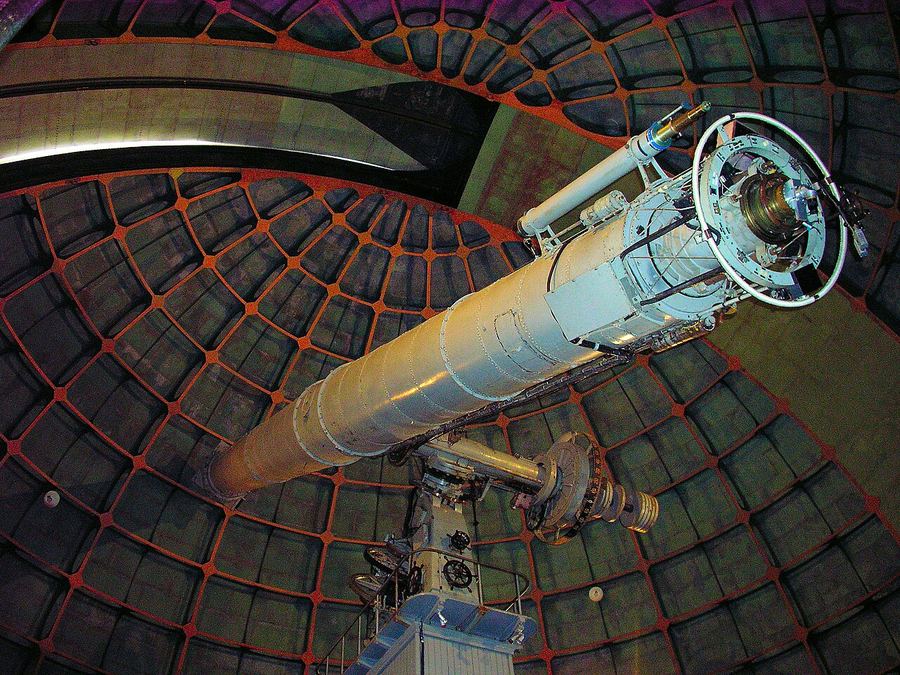 The long brass tube of the Great Lick Refractor inside its dome at Lick Observatory
